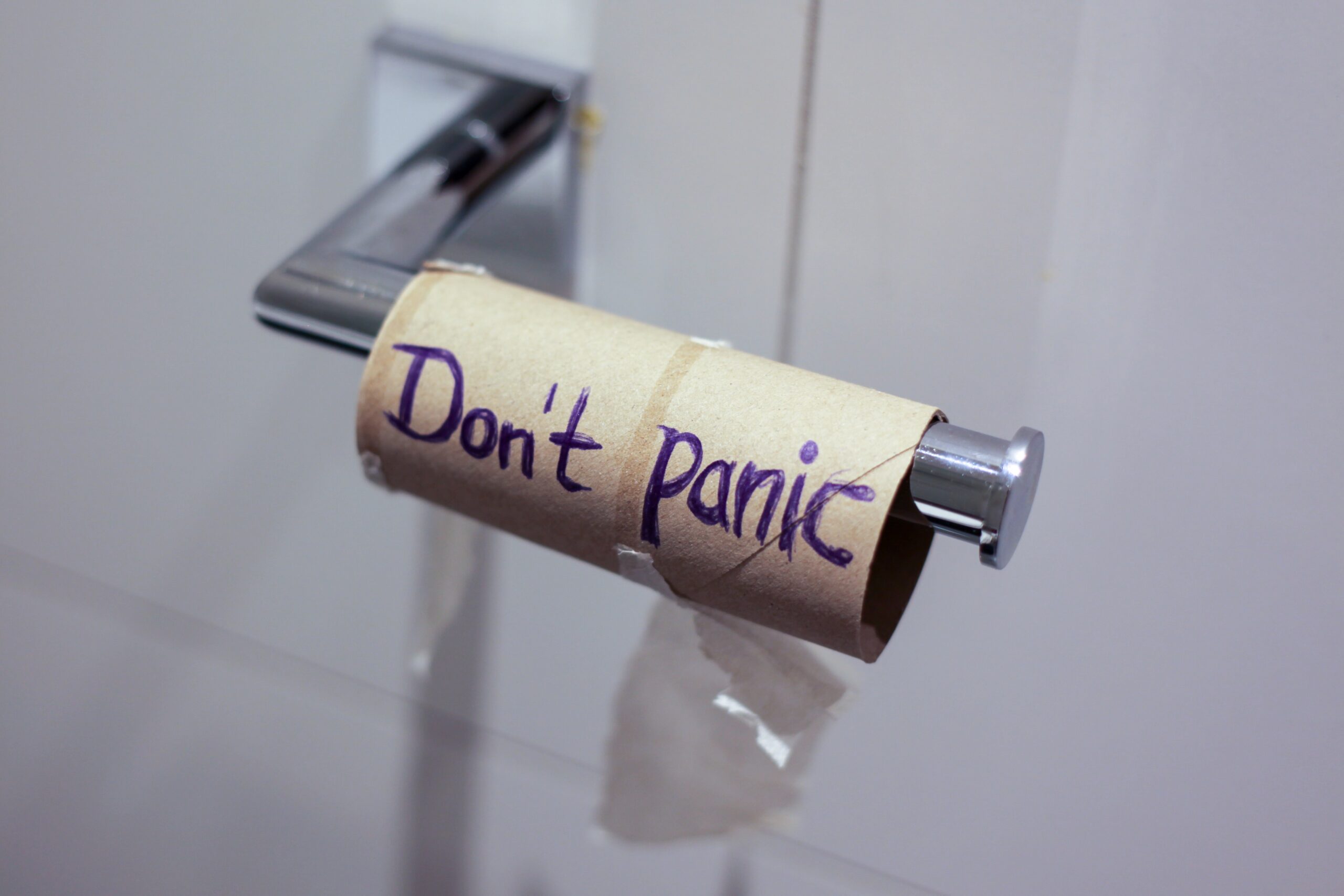 Don't panic written on empty TP roll